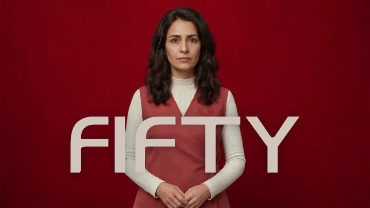 FIFTY film poster featuring a woman in red against a dark red background.
